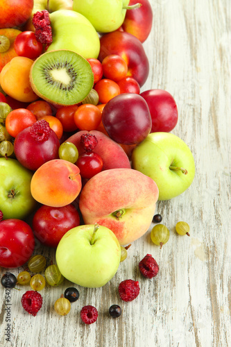 Naklejka na szybę Assortment of juicy fruits, on wooden background