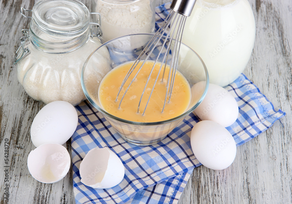 Ingredients for dough on wooden table close-up
