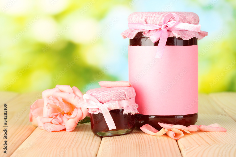 jars with rose jam and flower