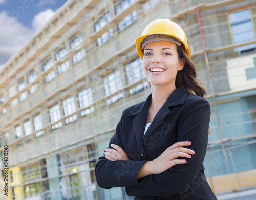 Fotografie, Obraz Portrait of Female Contractor Wearing Hard Hat at Construction S