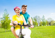 © Sergey Novikov - Smiling couple on the bike