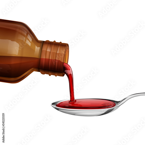 Fototapeta na wymiar Bottle pouring Medicine Syrup in Spoon