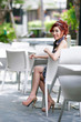 © pixs4u - Beautiful young woman sitting alone in street cafe
