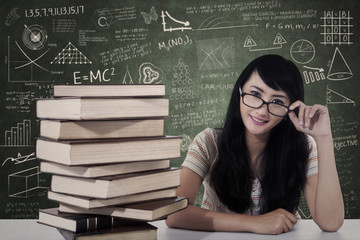 Wall Mural - Beautiful female nerd student study in class