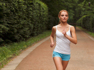 Woman Runner. Fitness Girl Running outdoors