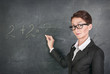 Woman teacher teaching maths