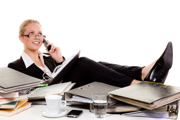 Wall Mural - relaxed young woman in front of a desk