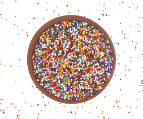 Wall Mural - Candy sprinkles in bowl with scattering of sprinkles