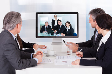 Group Of Businesspeople In Video Conference