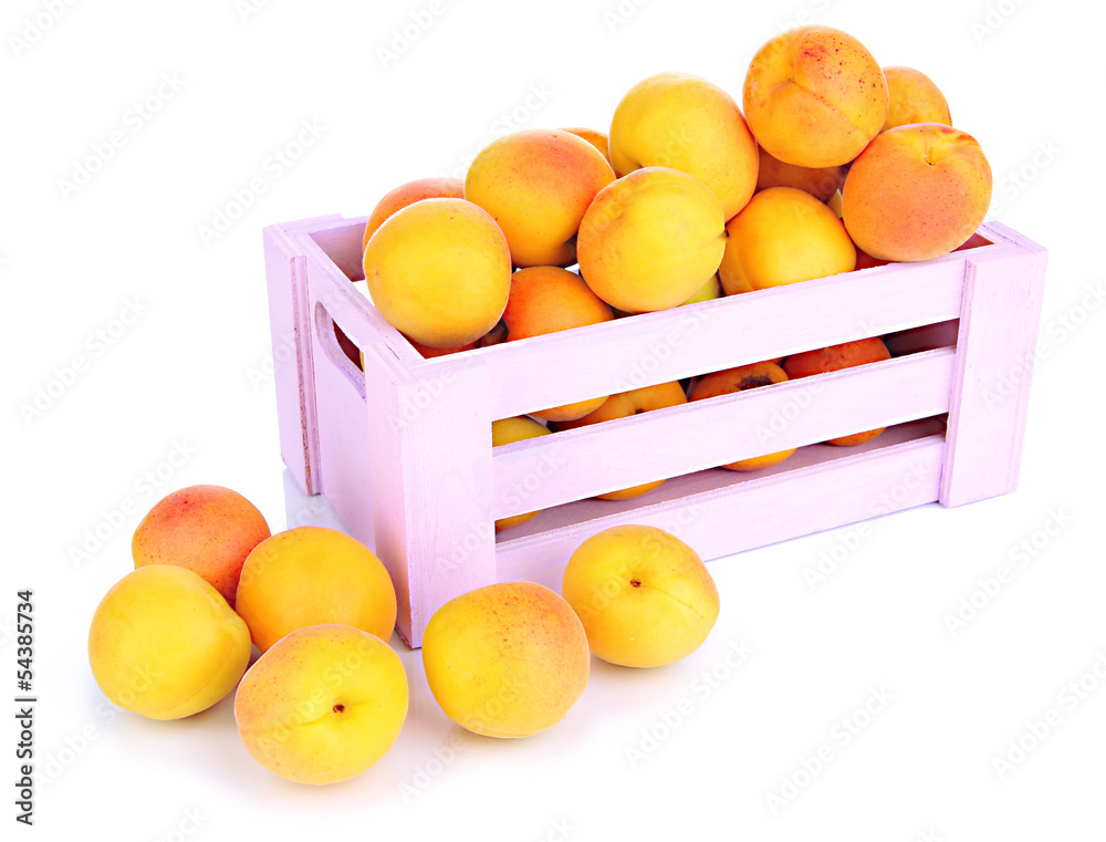 Fresh natural apricot in wooden box isolated on white