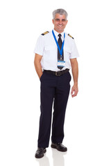 Wall Mural - middle aged man wearing airline pilot uniform