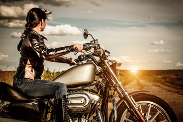 Wall Mural - Biker girl on a motorcycle