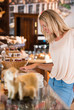 © Milles Studio - Positive young woman at the bakery store