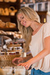 © Milles Studio - Positive young woman at the bakery store