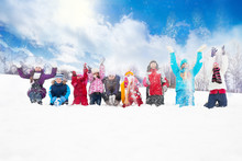 Group Of Kids Throwing Snow In The Air