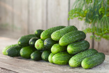 Cucumbers On Wooden Board