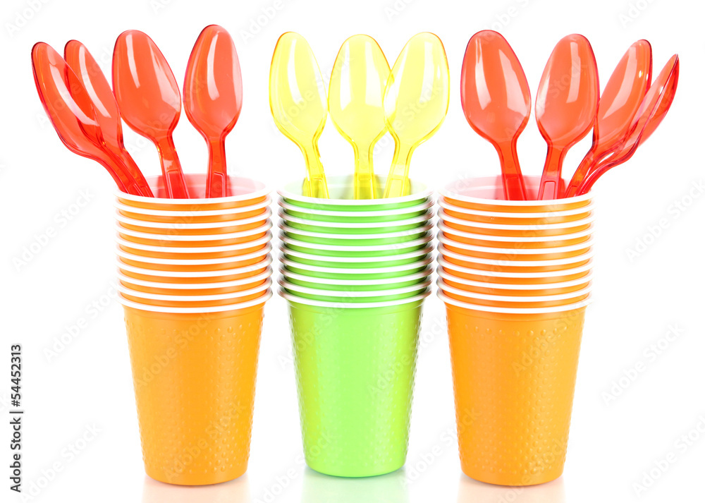 Cups and spoons in different color isolated on white