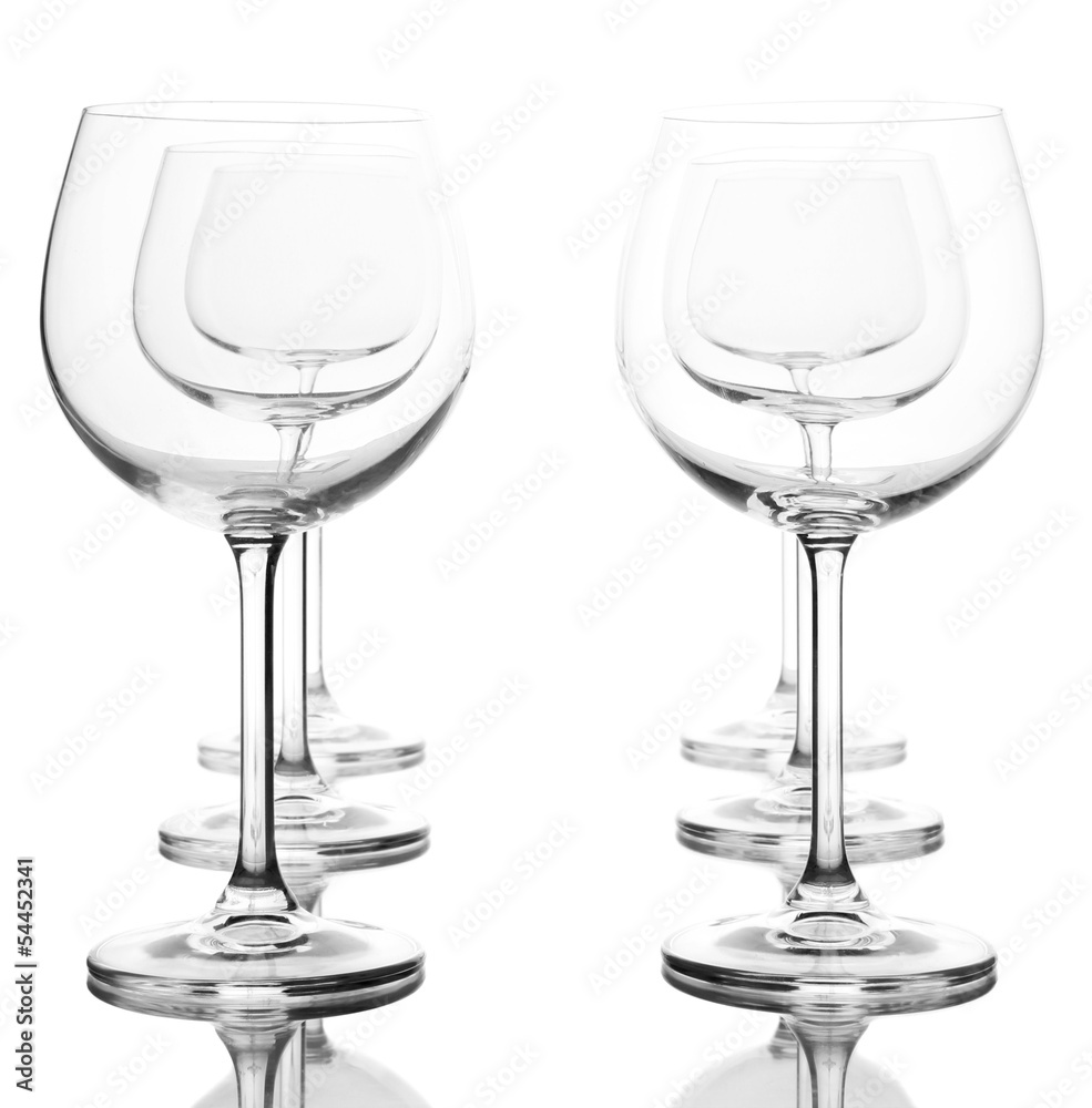 Empty wine glasses arranged and isolated on white