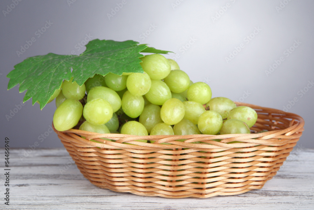 Ripe delicious grapes in wicker basket