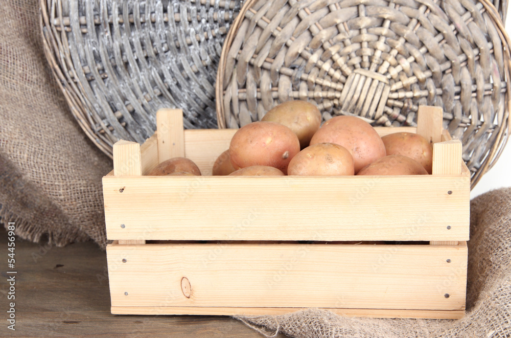 Potato on wooden table
