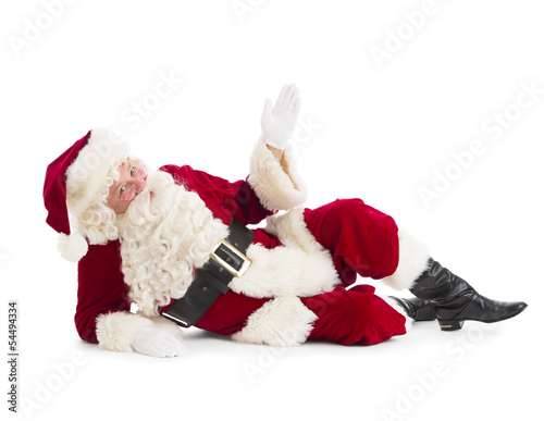 Fotografie, Obraz Portrait Of Santa Claus Gesturing While Lying On Floor