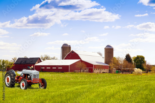 Traditional american red farm with tractor