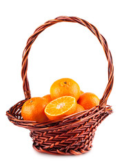 Wall Mural - Ripe tangerine in brown basket