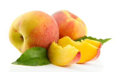 Wall Mural - Ripe sweet peaches with leaves, isolated on white