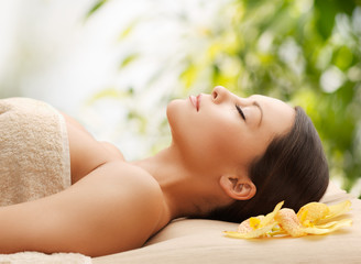 Poster - woman in spa lying on the massage desk