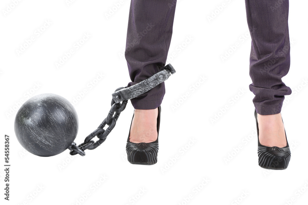 Business worker with ball and chain attached to foot isolated