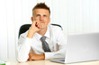 © Africa Studio - Portrait of young businessman in office