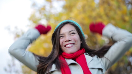 Wall Mural - Fall woman cheering celebrating in forest