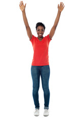 Excited woman raising her arms up