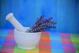 Fototapeta Lawenda - Lavender herbs in a mortar, healthy cosmetics concept