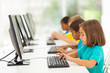 © michaeljung - elementary school students in computer class