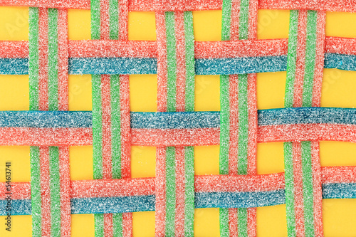 Tapeta ścienna na wymiar Sweet jelly candies on yellow background
