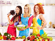 © Gennadiy Poznyakov - Group women preparing food at kitchen.