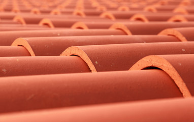 Red tile roof closeup photo with selective focus