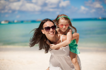 Sticker - Young beautiful mother and her adorable little daughter have fun