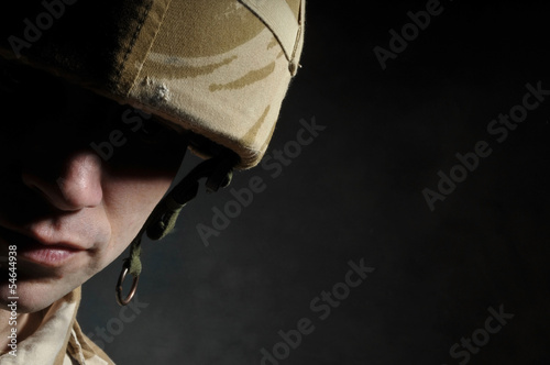 Fotografie, Obraz Portrait Of Soldier In Deep Shadow Suffering With PTSD