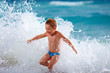 © Olesia Bilkei - happy boy kid having fun in sea water
