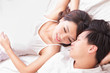 couple happy smile looking to each other in bed