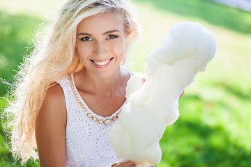 beautiful woman with candy floss in the park