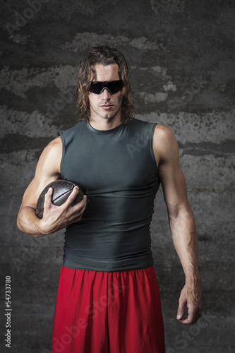 Muscle Man Is Wearing Sunglasses And Holding Football Ball Buy This Stock Photo And Explore Similar Images At Adobe Stock Adobe Stock Muscle Man Is Wearing Sunglasses And Holding Football Ball Buy This Stock Photo And Explore Similar Images At Adobe Stock Adobe Stock