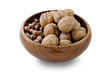 walnuts and hazelnuts in a wooden bowl on a white background