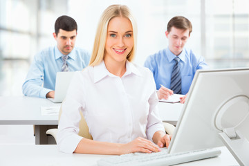 Wall Mural - Cute businesswoman in an office