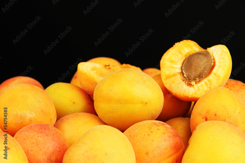 Fresh natural apricot on black background