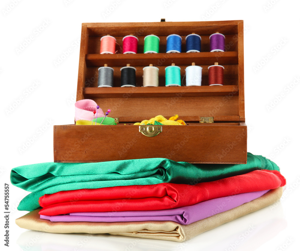 Sewing kit in wooden box and cloth isolated on white
