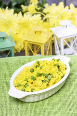 Canvas Print - Rice with green peas, popular indian dish on wooden table.