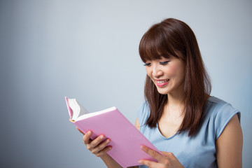 Poster - Asian woman reading a book